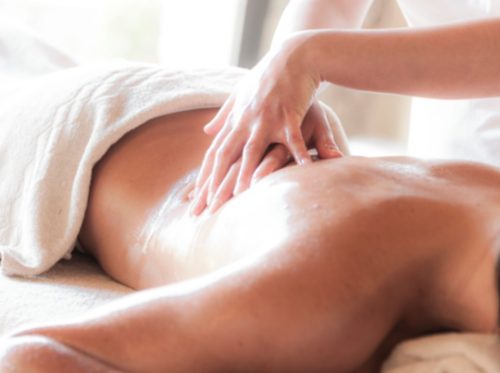 A soothing massage session in a serene spa environment promoting relaxation and wellness.